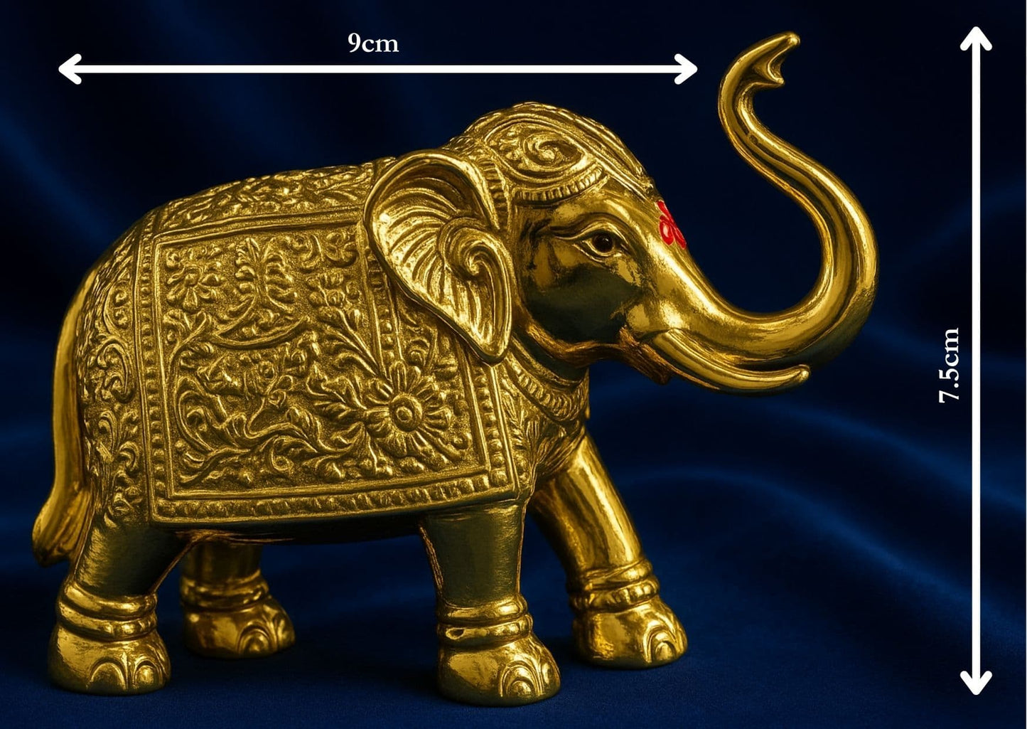 Decorative gold elephant figure with measurements on a dark blue background