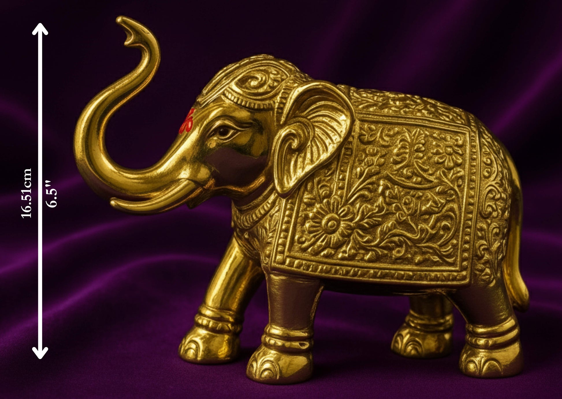Decorative gold elephant figure on a purple background with measurement details.